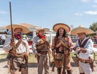 Lucio Jimenez, Pablo Martinez, Carlos Lara and Javier Rodrigjez of the the Los Liberadores Group pose menacingly at the Zapata County Fair in Zapata, Texas. Original image from <a href="https://www.rawpixel.com/search/carol%20m.%20highsmith?sort=curated&amp;page=1">Carol M. Highsmith</a>&rsquo;s America, Library of Congress collection. Digitally enhanced by rawpixel.