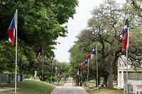 Texas state flags line a path through the Texas State Cemetery in Austin. Original image from <a href="https://www.rawpixel.com/search/carol%20m.%20highsmith?sort=curated&amp;page=1">Carol M. Highsmith</a>&rsquo;s America, Library of Congress collection. Digitally enhanced by rawpixel.