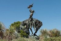 One of seven castings of sculptor Buck McCain&#39;s bronze &quot;Invocation&quot; sculpture, which stands outside the Stark Museum of Western Art in Orange, Texas.