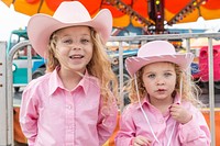 Samantha and Scarlett Santana have some fun in the ride area of a carnival outside the event locations Rodeo Austin, the city&#39;s annual stock show and rodeo.