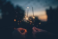 Sparklers in hands. Original public domain image from Wikimedia Commons