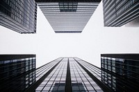 A low-angle shot of tall office buildings on a cloudy day. Original public domain image from <a href="https://commons.wikimedia.org/wiki/File:Office_buildings_under_clouds_(Unsplash).jpg" target="_blank" rel="noopener noreferrer nofollow">Wikimedia Commons</a>