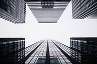 A low-angle shot of tall office buildings on a cloudy day. Original public domain image from Wikimedia Commons