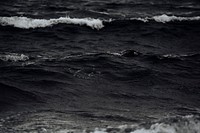 Black and white shot of sea waves with ocean foam in Iceland. Original public domain image from Wikimedia Commons