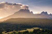 The trees, the mountains, and the clouds in the Dolomites. Original public domain image from Wikimedia Commons