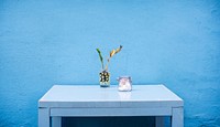 Blue wall and table. Original public domain image from Wikimedia Commons