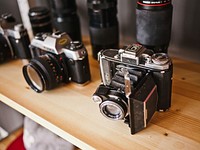 Vintage cameras and lenses on a shelf. Original public domain image from <a href="https://commons.wikimedia.org/wiki/File:Vintage_cameras_(Unsplash).jpg" target="_blank" rel="noopener noreferrer nofollow">Wikimedia Commons</a>