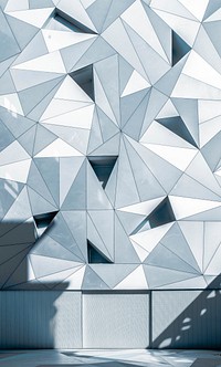 A pattern with gray and white triangles on a building facade in Madrid. Original public domain image from <a href="https://commons.wikimedia.org/wiki/File:Gray_triangles_on_a_facade_(Unsplash).jpg" target="_blank" rel="noopener noreferrer nofollow">Wikimedia Commons</a>