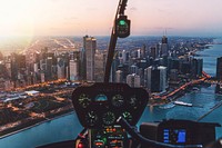 View from an airplane cockpit on the skyline of Chicago at night. Original public domain image from <a href="https://commons.wikimedia.org/wiki/File:Sunset_Chicago_Skyline_(Unsplash).jpg" target="_blank" rel="noopener noreferrer nofollow">Wikimedia Commons</a>