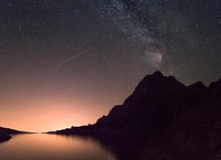 A starry night sky over a lake in the Tatra mountains. Original public domain image from <a href="https://commons.wikimedia.org/wiki/File:Starry_sky_over_the_Tatras_(Unsplash).jpg" target="_blank" rel="noopener noreferrer nofollow">Wikimedia Commons</a>