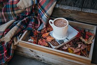 A mug of hot chocolate and a book. Original public domain image from <a href="https://commons.wikimedia.org/wiki/File:Hot_chocolate_(Unsplash).jpg" target="_blank">Wikimedia Commons</a>