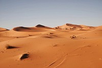 Desolate sand dunes and gray sky in the Sahara Desert. Original public domain image from Wikimedia Commons