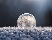 A macro view of a frozen winter ball on the cold winter ground. Original public domain image from Wikimedia Commons