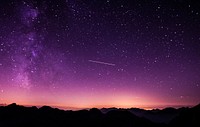 A starry purple-hued night sky over the silhouettes of undulating mountains. Original public domain image from Wikimedia Commons