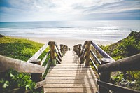 The walkway stairs to the beach. Original public domain image from <a href="https://commons.wikimedia.org/wiki/File:Khachik_Simonian_2017_(Unsplash).jpg" target="_blank">Wikimedia Commons</a>