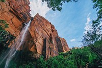 Sandstone cliff with a waterfall. Original public domain image from Wikimedia Commons