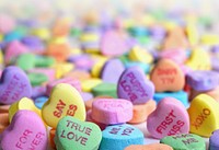Candy Valentine hearts with slogans receding into the distance. Original public domain image from Wikimedia Commons