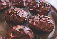 Homemade chocolate cupcakes with chocolate frosting and rainbow sprinkles. Original public domain image from <a href="https://commons.wikimedia.org/wiki/File:Homemade_Cupcakes_(Unsplash).jpg" target="_blank" rel="noopener noreferrer nofollow">Wikimedia Commons</a>