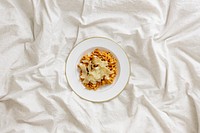 Bowl of pasta with parmesan cheese on a white bed sheet. Original public domain image from <a href="https://commons.wikimedia.org/wiki/File:Pasta_in_Bed_(Unsplash).jpg" target="_blank" rel="noopener noreferrer nofollow">Wikimedia Commons</a>