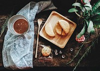 Biscuit with hot chocolate on a table. Original public domain image from <a href="https://commons.wikimedia.org/wiki/File:Ubon_Ratchathani,_Thailand_(Unsplash).jpg" target="_blank">Wikimedia Commons</a>