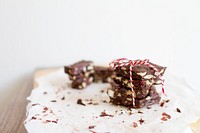 Peppermint, nut, chocolate bark tied together with red and white bakers twine. Original public domain image from Wikimedia Commons