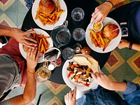 The top view of friends eating lunch in a diner Vršovice, Prague, Praha 101, Prague, Czech Republic. Original public domain image from Wikimedia Commons