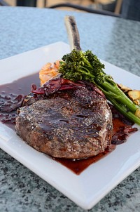 Plate of steak and broccoli with brown sauce for dinner. Original public domain image from Wikimedia Commons