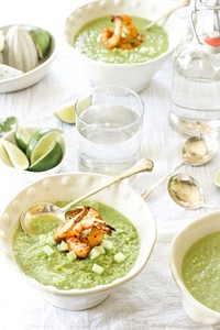 Bowls of green gazpacho soup with shrimp, limes, and cucumbers for a light dinner. Original public domain image from Wikimedia Commons