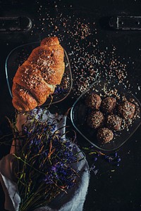 Rustic bakery tablescape with french croissant, chocolate truffles, and dried flowers. Original public domain image from <a href="https://commons.wikimedia.org/wiki/File:Rustic_Bakery_Treats_(Unsplash).jpg" target="_blank" rel="noopener noreferrer nofollow">Wikimedia Commons</a>