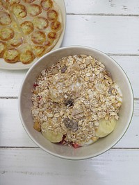 A bowl of oatmeal and a plate of bananas cooked in custard. Original public domain image from <a href="https://commons.wikimedia.org/wiki/File:Healthy_Breakfast_(Unsplash).jpg" target="_blank" rel="noopener noreferrer nofollow">Wikimedia Commons</a>