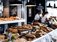 Bread and pastries on a display in a bakery. Original public domain image from Wikimedia Commons