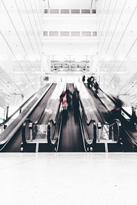 A time exposure shot capturing people using an escalator in a Chicago building. Original public domain image from <a href="https://commons.wikimedia.org/wiki/File:Escalation_(Unsplash).jpg" target="_blank" rel="noopener noreferrer nofollow">Wikimedia Commons</a>