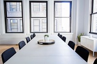 An empty conference room in an office with a table, chairs and big windows. Original public domain image from Wikimedia Commons