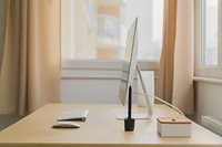 An orderly computer workspace near a window. Original public domain image from <a href="https://commons.wikimedia.org/wiki/File:Winter_Workspace_2_(Unsplash).jpg" target="_blank" rel="noopener noreferrer nofollow">Wikimedia Commons</a>