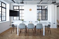 A small conference room with a white table and a television. Original public domain image from Wikimedia Commons