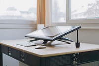A Wacom drawing tablet on a desk in a corner of a room. Original public domain image from Wikimedia Commons