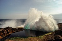 An ocean wave hitting rocks and creating spray on the coast. Original public domain image from <a href="https://commons.wikimedia.org/wiki/File:Ocean_Spray_(Unsplash).jpg" target="_blank" rel="noopener noreferrer nofollow">Wikimedia Commons</a>