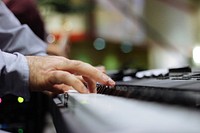 A close-up of a man's hands on a piano keyboard. Original public domain image from <a href="https://commons.wikimedia.org/wiki/File:Fingers_on_the_piano_keys_(Unsplash).jpg" target="_blank" rel="noopener noreferrer nofollow">Wikimedia Commons</a>