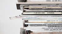 A close-up of a stack of old vinyl records. Original public domain image from Wikimedia Commons