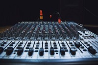 Even rows of dials on a mixing console. Original public domain image from <a href="https://commons.wikimedia.org/wiki/File:Mixing_console_in_Korsze_(Unsplash).jpg" target="_blank" rel="noopener noreferrer nofollow">Wikimedia Commons</a>