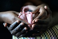 Mother, father and a newborn. Original public domain image from Wikimedia Commons