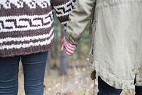 Two person holding hands. Original public domain image from Wikimedia Commons