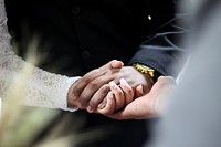 Man and woman holding hands. Original public domain image from Wikimedia Commons