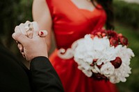 Newlyweds and flower bouquet. Original public domain image from Wikimedia Commons