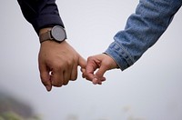 Man and woman holding hands. Original public domain image from Wikimedia Commons