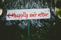 A hand-painted sign reads "Happily ever after". Original public domain image from Wikimedia Commons