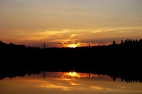 Golden sunset in Gander Bay with forest reflection in the lake. Original public domain image from Wikimedia Commons