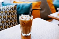 The macro view of a cup of latte with straw in it in Coupi bar. Original public domain image from <a href="https://commons.wikimedia.org/wiki/File:Cup_of_latte_with_straw_(Unsplash).jpg" target="_blank" rel="noopener noreferrer nofollow">Wikimedia Commons</a>