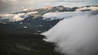 Clouds gathering over wet plains in the mountains. Original public domain image from Wikimedia Commons