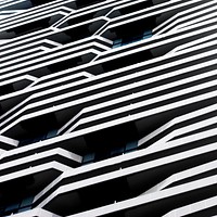 Black and white macro of modern line building architecture with windows in Toronto. Original public domain image from <a href="https://commons.wikimedia.org/wiki/File:Daedalus_(Unsplash).jpg" target="_blank" rel="noopener noreferrer nofollow">Wikimedia Commons</a>